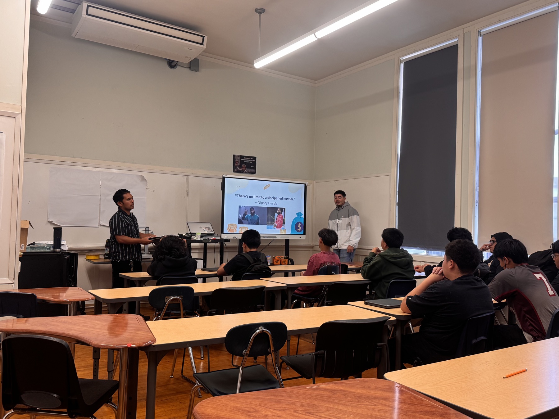 Zymbolic facilitators leading a session with high school students in a classroom